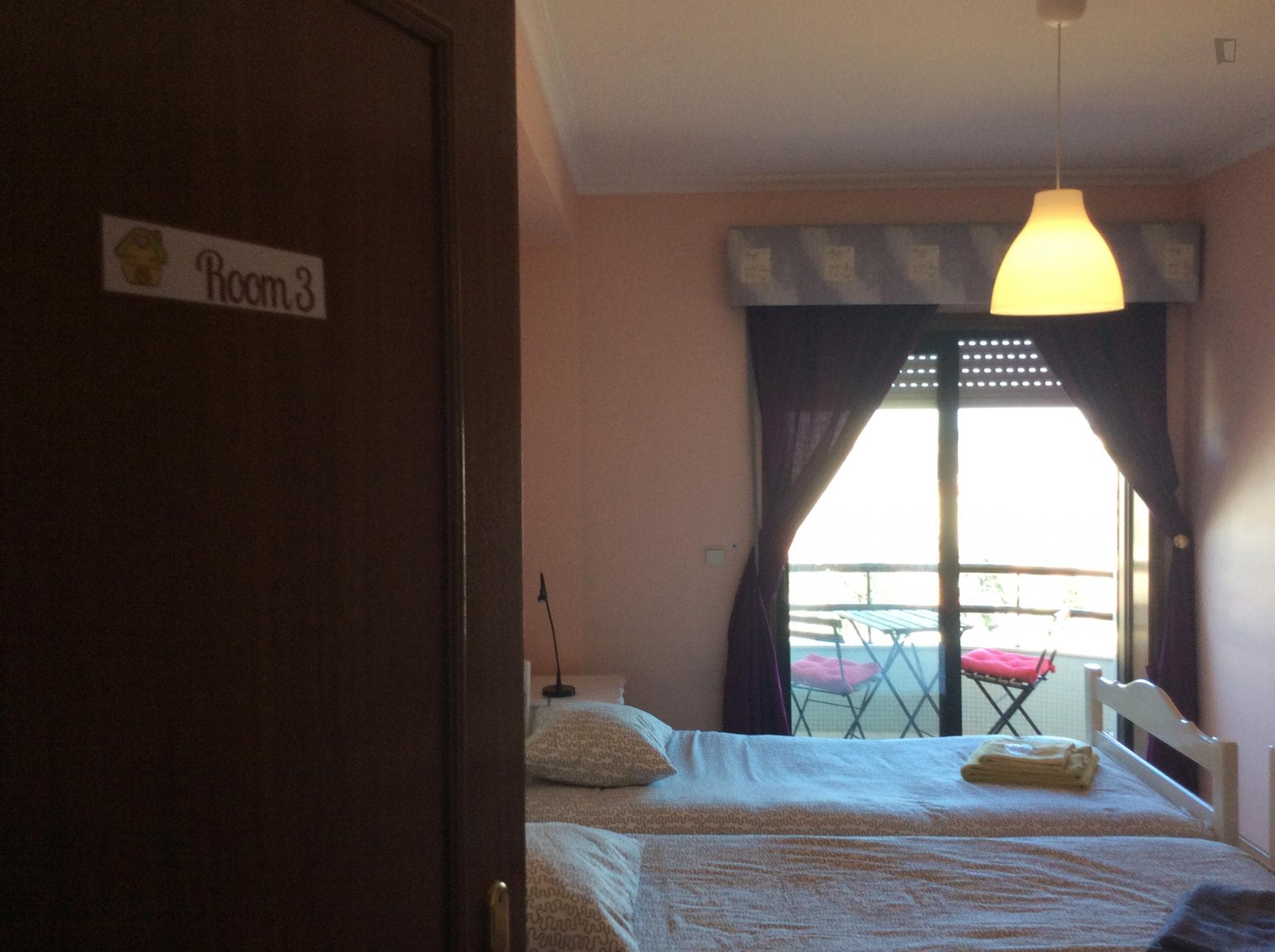 Bright twin bedroom with balcony photo 1