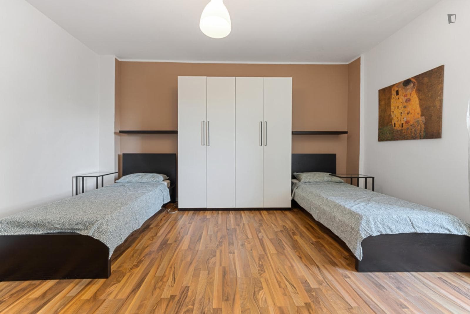 Bed in a comfy twin bedroom near Università Bocconi photo 1