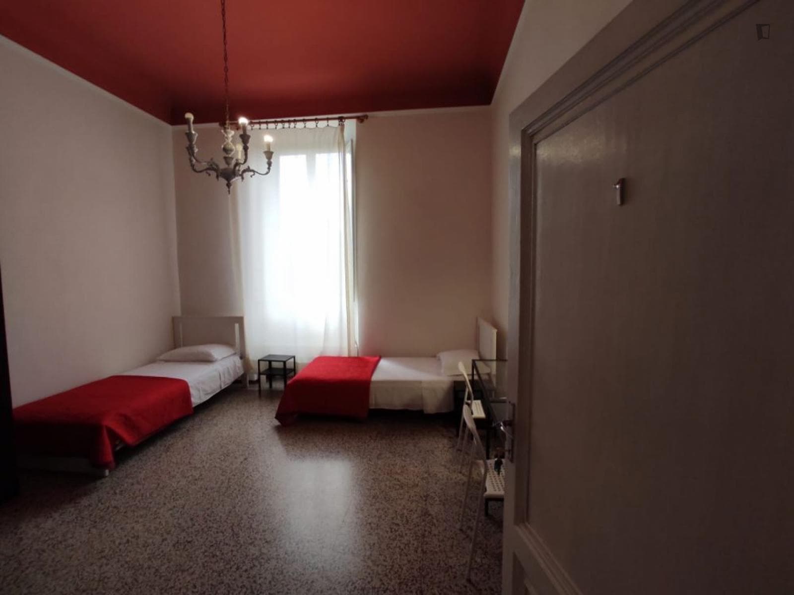 Bed in bright twin bedroom near Parco di Villa Strozzi photo 1