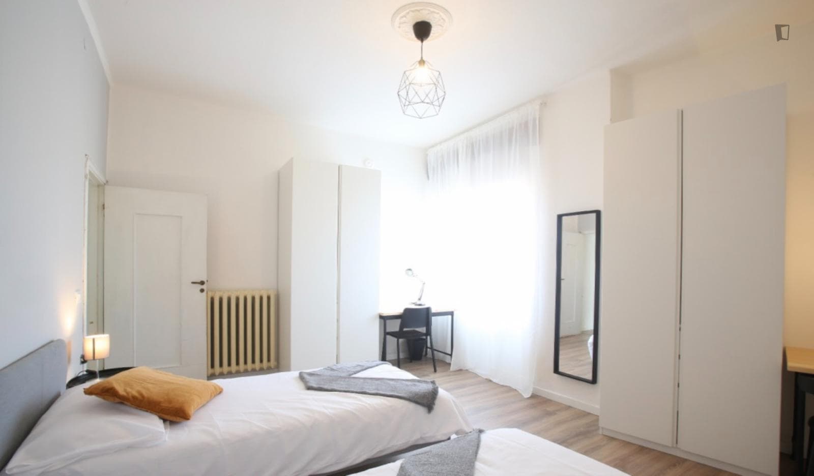 Bed in a twin bedroom near Parco Giardino Ducale Estense photo 1