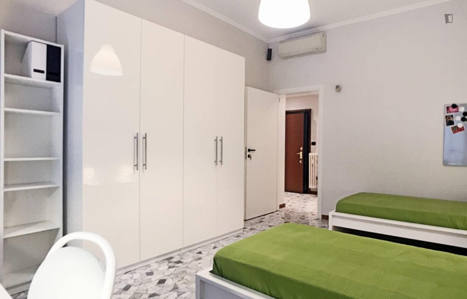 Bed in a twin bedroom in the bustling neighbourhood of De Angeli photo 1