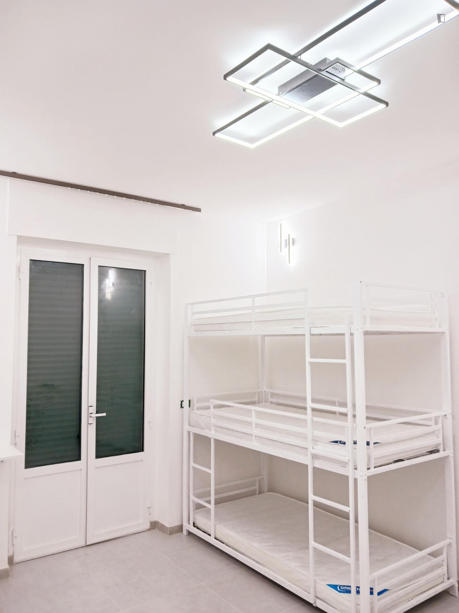 Bed in a comfy shared bedroom, in Fiera photo 1