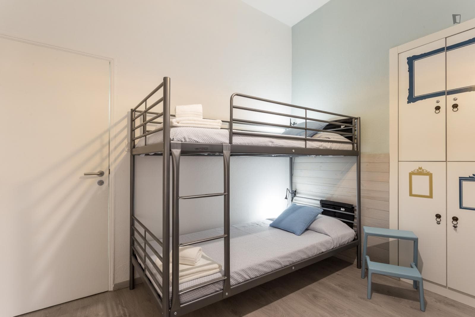 Cute 1-Bunk Bed Bedroom at 10 Bedroom Apartment photo 1