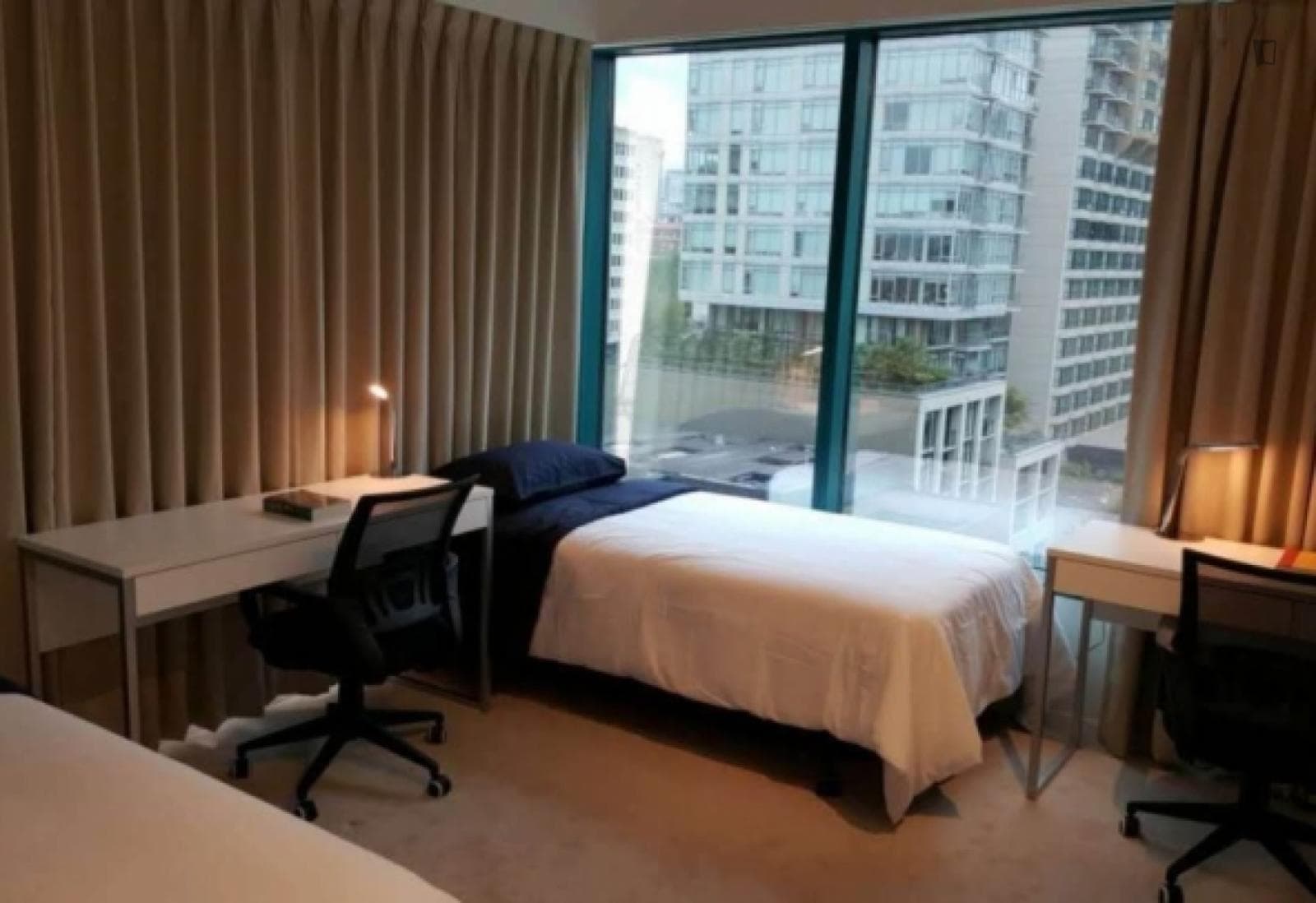 Bed in a welcoming twin bedroom, in Downtown Vancouver photo 1